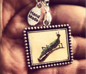 Resin art pendant with ball chain silver frame abstract Cricket
